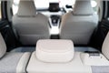 Shallow focus of rear headrest seen inside an empty car.