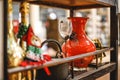 Shallow focus shot of antique colorful glass cup, vase and bottles on a shelf in a Bookstore Royalty Free Stock Photo