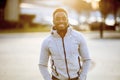 Shallow focus shot of an attractive African American male smiling at the camera Royalty Free Stock Photo