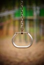 Shallow focus shot of a hanging exercise ring with blur background Royalty Free Stock Photo