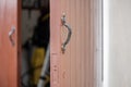 Shallow focus of timber built garage doors, showing the right door opened Royalty Free Stock Photo