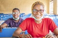 Shallow focus of two young African students wearing facemasks and studying in a classroom Royalty Free Stock Photo