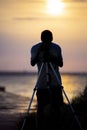 Shallow focus vertical shot of a person taking a photo