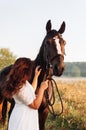 Shallow focus vertical shot of a woman petting a horse Royalty Free Stock Photo