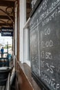 Shallow focus view of a chalk type train timetable seen on an old railway station. Royalty Free Stock Photo