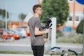 Shallow focus of a young male photographer filming an event outdoors