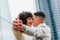 Shallow focus of a young romantic couple dancing and kissing outdoors Royalty Free Stock Photo