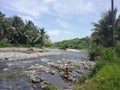 Shallow river flowing through tropical landscape on Mindoro, Philippines