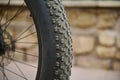 Shallow tread of a bicycle tubeless tire. Details on tubeless tire of an electric motor bike, mountain bike. Cropped