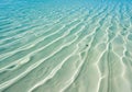 Shallow Turquoise Ocean Water with Sunlight Patterns on Sandy Seabed Royalty Free Stock Photo