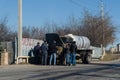 Shamakhi, Azerbaijan - January 07 2022- Group of men checking old Russian truck and trying to fix it