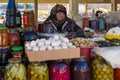 Shamakhi, Azerbaijan - January 07 2022- Local market vendor woman with her head covered