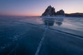 Shaman rock, sacred stone of Olkhon island in a beautiful morning sunrise, Baikal lake in winter, Siberia, Russia Royalty Free Stock Photo