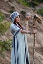 Shaman with Staff holding glass ball outdoor