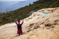 Shaman summoning spirits at the mineral terraces in Baishutai, China. The magic, incantation, occultism. Royalty Free Stock Photo