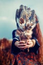 Shaman woman and shamanic feathers on denim. Royalty Free Stock Photo