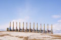 Shamanic pillars with colored ribbons on Olkhon Island near Lake Baikal. Ritual pillar. Winter, Russia. Royalty Free Stock Photo