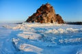 Shamanka rock in winter sunset. Olkhon island, Baikal lake, Siberia, Russia Royalty Free Stock Photo