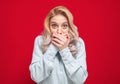Shame. Close up beautiful young woman covering face with hands, isolated on red background. Oops. Ashamed girl Royalty Free Stock Photo