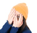 Shame. Close up young woman covering face with hands, isolated on white background. Oops. Ashamed girl.