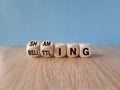 Shaming and belittling symbol. Concept words Shaming and Belittling on wooden cubes. Beautiful wooden table blue background. Royalty Free Stock Photo