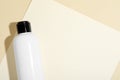 Shampoo in bottle on beige background, top view. Space for text Royalty Free Stock Photo