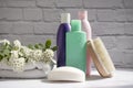 Shampoo bottle, soap, flower on old background Royalty Free Stock Photo