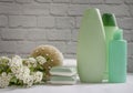 Shampoo bottle, soap, flower on old background package Royalty Free Stock Photo