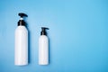 Shampoo conditioner,balm,natural organic cosmetics, dispenser on a blue background,copy space