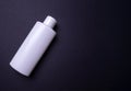 Shampoo or hair conditioner bottle isolated on black background Royalty Free Stock Photo