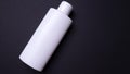 Shampoo or hair conditioner bottle isolated on black background Royalty Free Stock Photo