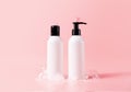 Shampoo and hair conditioner bottle with soapy bubbles. Beauty hair care cosmetic packaging mockup Royalty Free Stock Photo