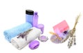 Shampoo and soap with lavender extract, scented candles and bath towels isolated on white . Collage