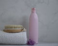 Shampoo, towel, massage brush bath on a colored background