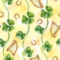 Shamrock and horseshoes seamless pattern on orange watercolor backdrop. Painted clover and harp. Hand drawn Celtic Royalty Free Stock Photo