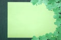 Shamrocks on a blank paper sheet