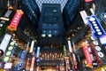 SHANGHAI CHINA, APR 2018 : Restaurant billboard color and neon lighting at Caobao shopping mall with texture glass roof