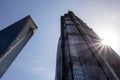 Bottom view of Jin Mao Tower skyscraper in Shanghai, China with a Sun and strong lens flare effect Royalty Free Stock Photo