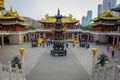 SHANGHAI, CHINA: Beautiful temple building with golden roof sorrounding ancient plaza with very nice statue centered