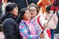 Shanghai, China - Jan. 26, 2019: Lantern Festival in the Chinese New Year Pig year, happy family take selfie in crowded people.