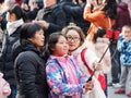 Shanghai, China - Jan. 26, 2019: Lantern Festival in the Chinese New Year Pig year, happy family take selfie in crowded people.