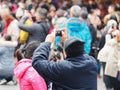 Shanghai, China - Jan. 26, 2019: Lantern Festival in the Chinese New Year Pig year, elder man take photos in crowded people