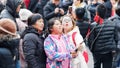 Shanghai, China - Jan. 26, 2019: Lantern Festival in the Chinese New Year Pig year, happy family take selfie in crowded people.