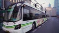 Shanghai, China - January 15, 2018: Electric powered hybrid bus charging on street near bus stop