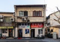 Roadside traditional stores of foot massage, mobile phone repair and home appliance repair on Wan`an Rd in Jiangwanzhen