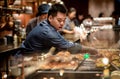 A Starbucks barista making coffee for their customer at the Starbucks Reserve Roastery in Shanghai