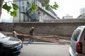 SHANGHAI, CHINA - June 2018: Chinese construction worker wiping sweat with arm, isolated person