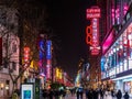 SHANGHAI, CHINA - 12 MAR 2019 Ã¢â¬â Night /Evening view of the lights, shoppers and pedestrians along Nanjing East Road Nanjing