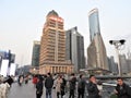 People walking near Ping Finance Building & China Tower in front of Oriental Pearl Tower, Lujiazui, Pudong, Shanghai, China