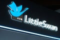close up Little Swan store sign